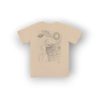 A beige short-sleeve t-shirt with a black line art graphic of a woman's profile with celestial elements like a sun, moon, and planets in her hair, shown on a white background.