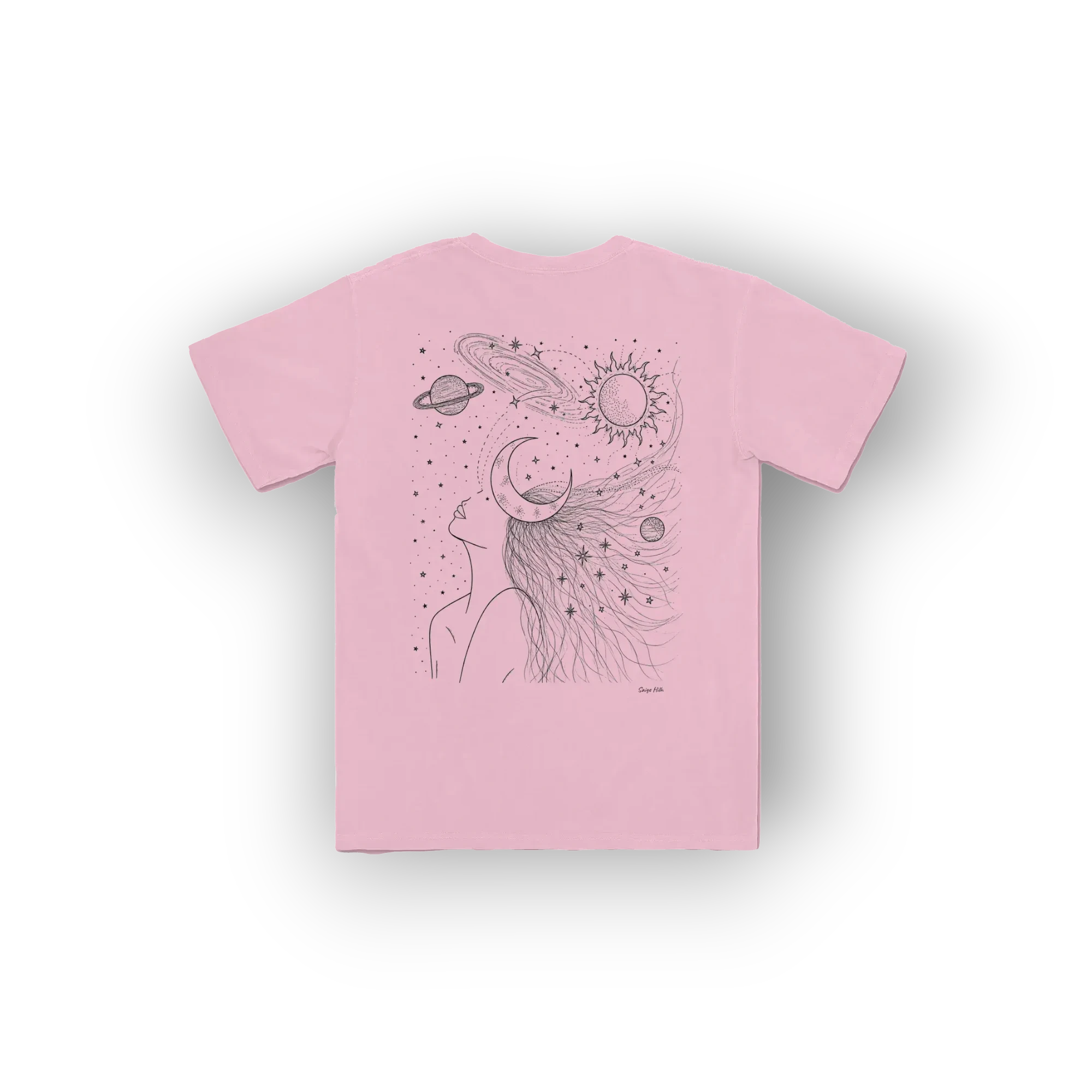 A light pink short-sleeve t-shirt with a black line art graphic of a woman's profile looking up at a crescent moon and a sun with planets, shown against a plain white background.
