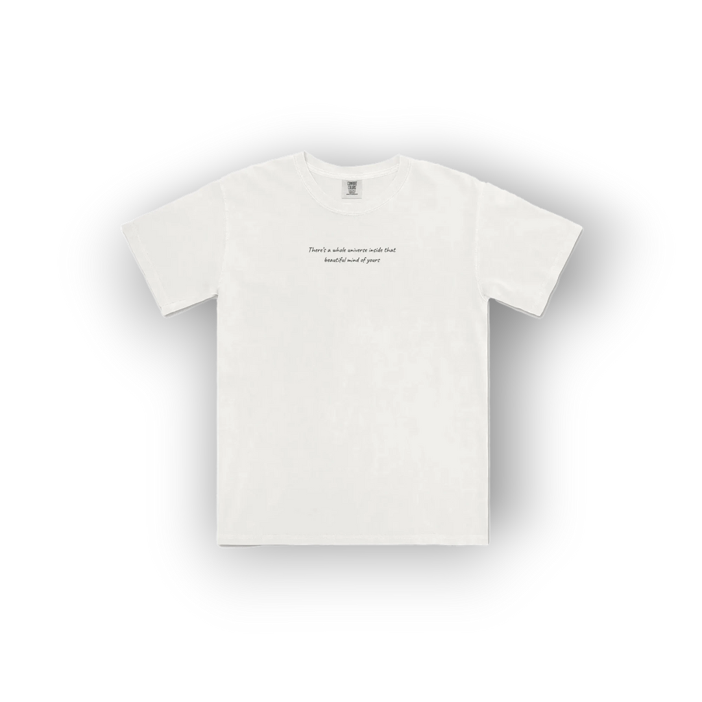 A white short-sleeve crewneck t-shirt with a small black printed quote on the center chest, displayed against a clean white background with a soft drop shadow.