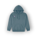A slate blue pullover hoodie with a small pink embroidered 'SH' logo on the left chest, displayed against a clean white background with a soft drop shadow.