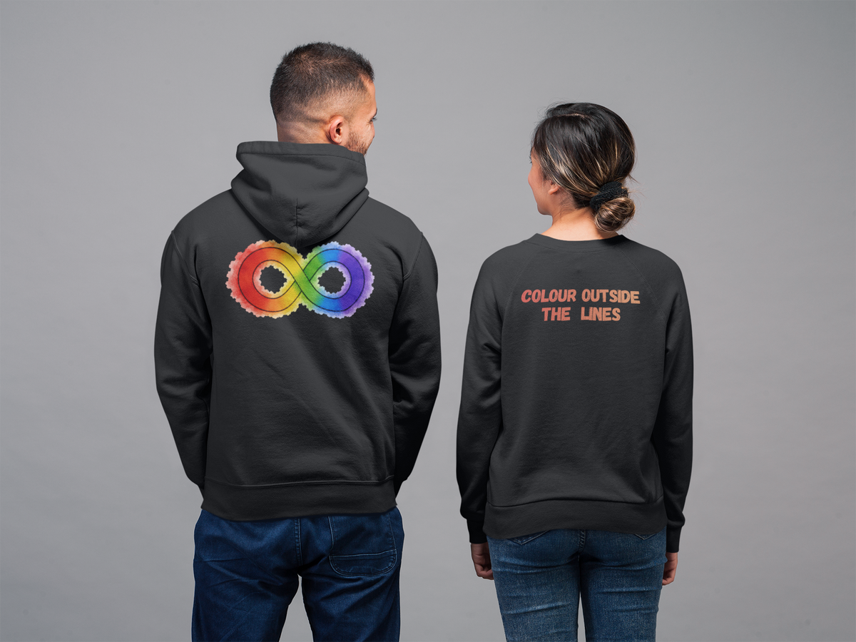 A man and a woman shown from behind wearing matching black hoodies and sweatshirts with rainbow-colored back graphics, against a plain gray studio background.