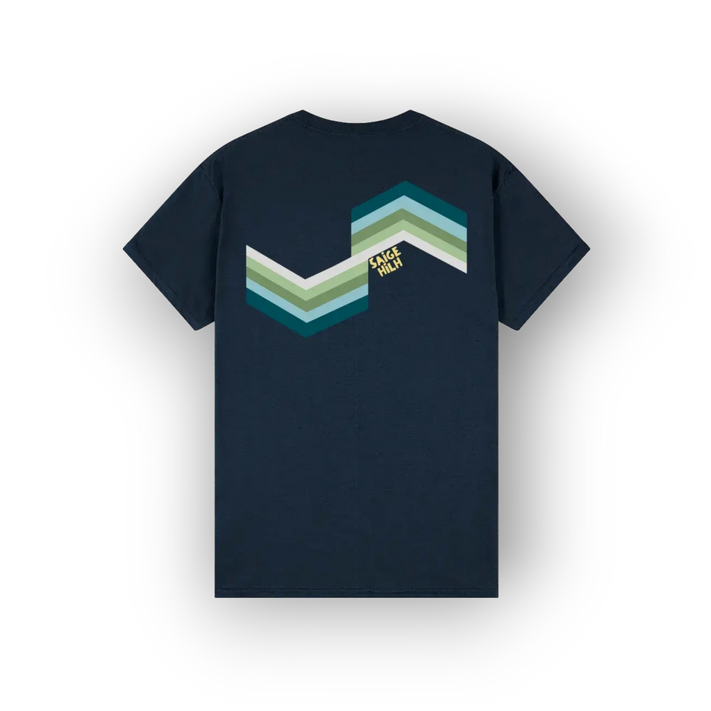 A navy blue short-sleeve t-shirt shown from the back, featuring a retro chevron graphic in shades of teal, green, and white, with a small yellow 'SAIGE HILH' logo.