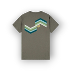 An olive green short-sleeve t-shirt shown from the back, featuring a large chevron graphic in shades of teal, blue, green, and white, with a small yellow 'SAIGE HILH' logo.