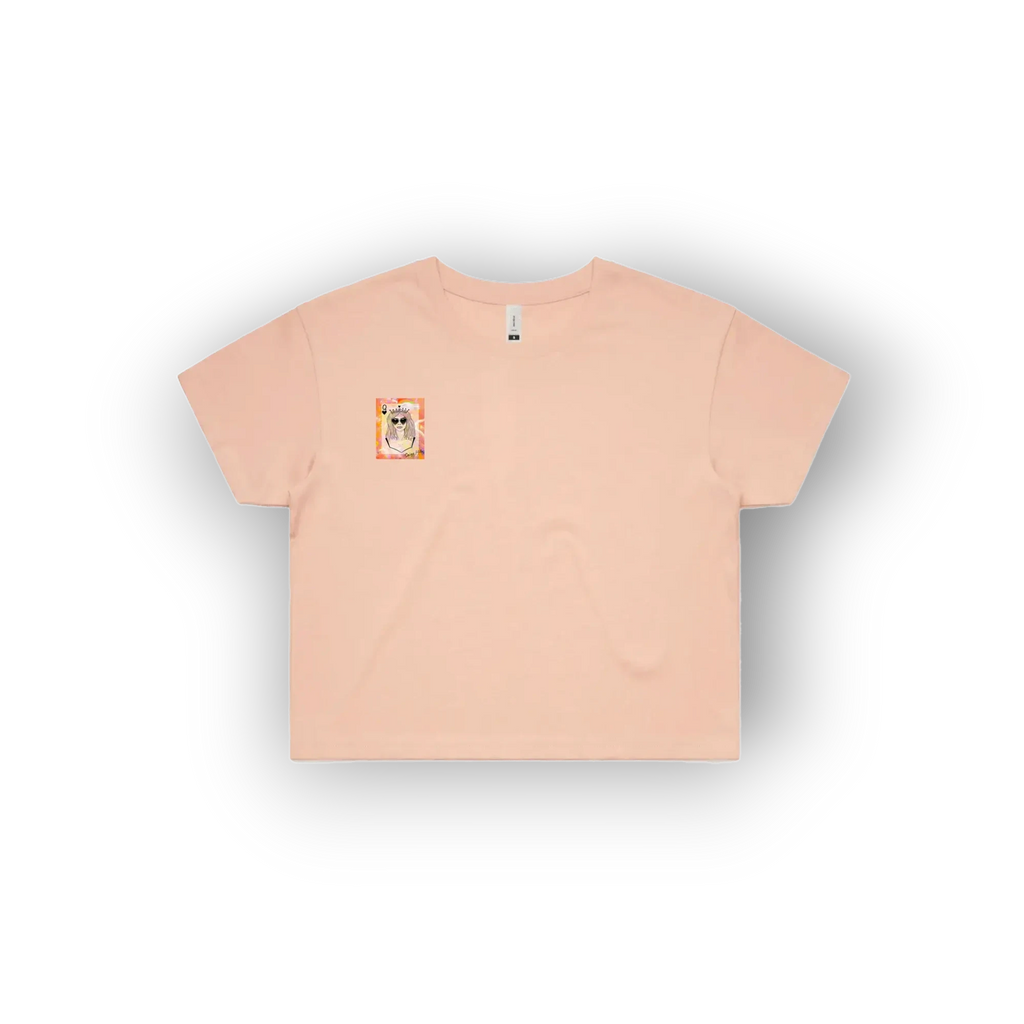 A light peach-pink short-sleeve t-shirt with a small square graphic on the left chest, displayed flat against a white background with a soft drop shadow.