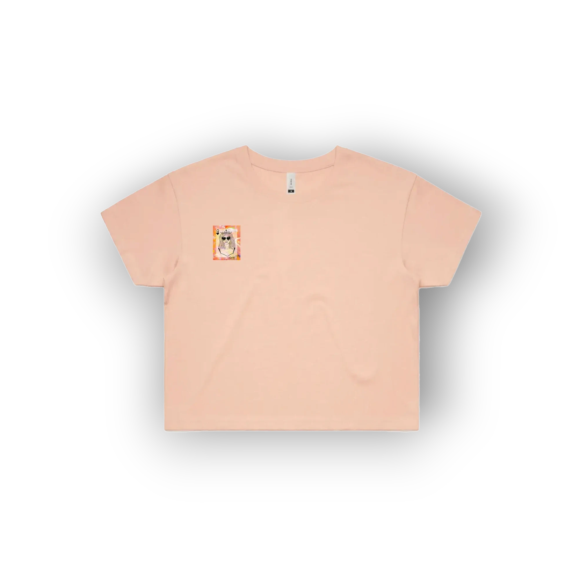 A light peach-pink short-sleeve t-shirt with a small square graphic on the left chest, displayed flat against a white background with a soft drop shadow.