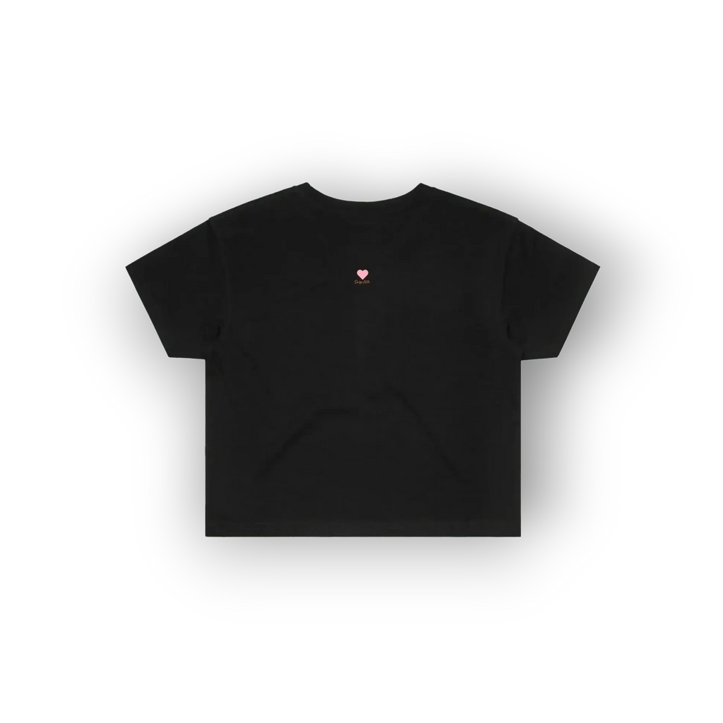 A black short-sleeve crop top t-shirt with a small pink heart graphic and text on the left chest, displayed on a clean white background with a soft drop shadow.
