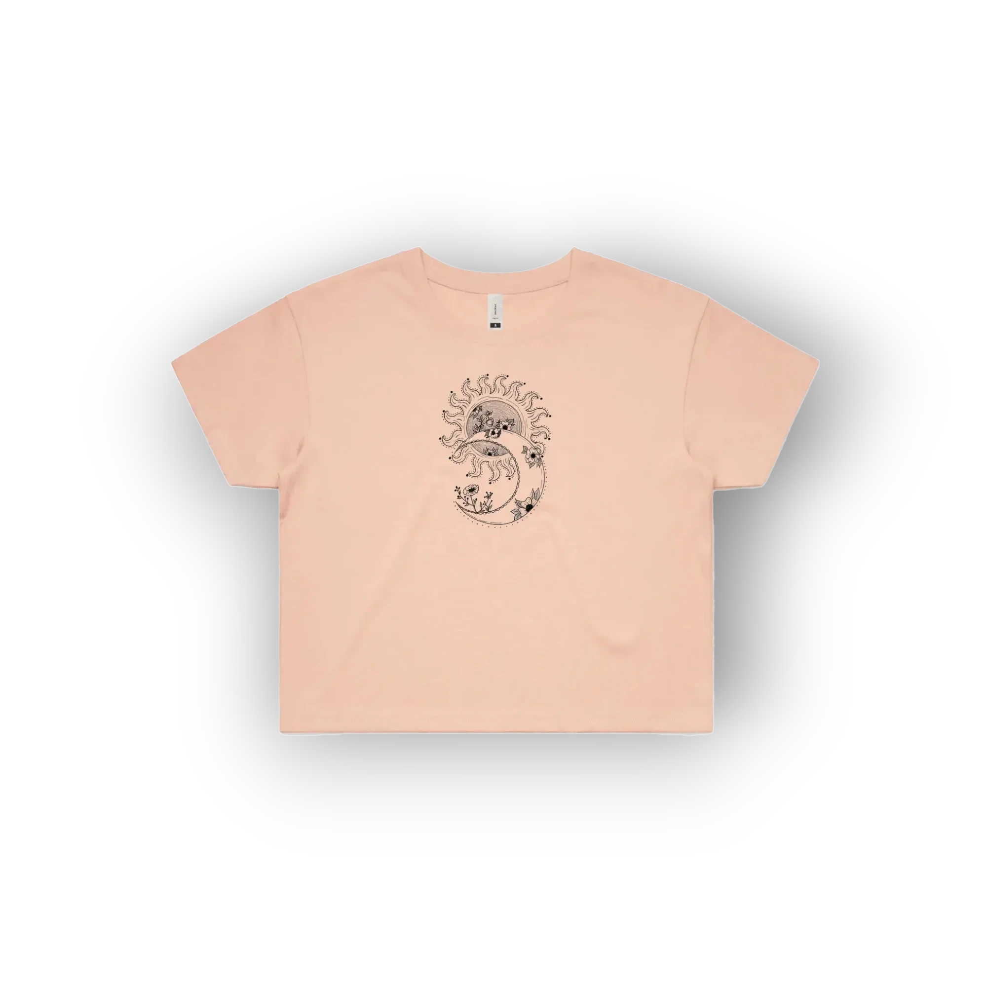 A light peach-pink short-sleeve t-shirt with a central graphic of a stylized dragon on a crescent moon, displayed on a clean white background.