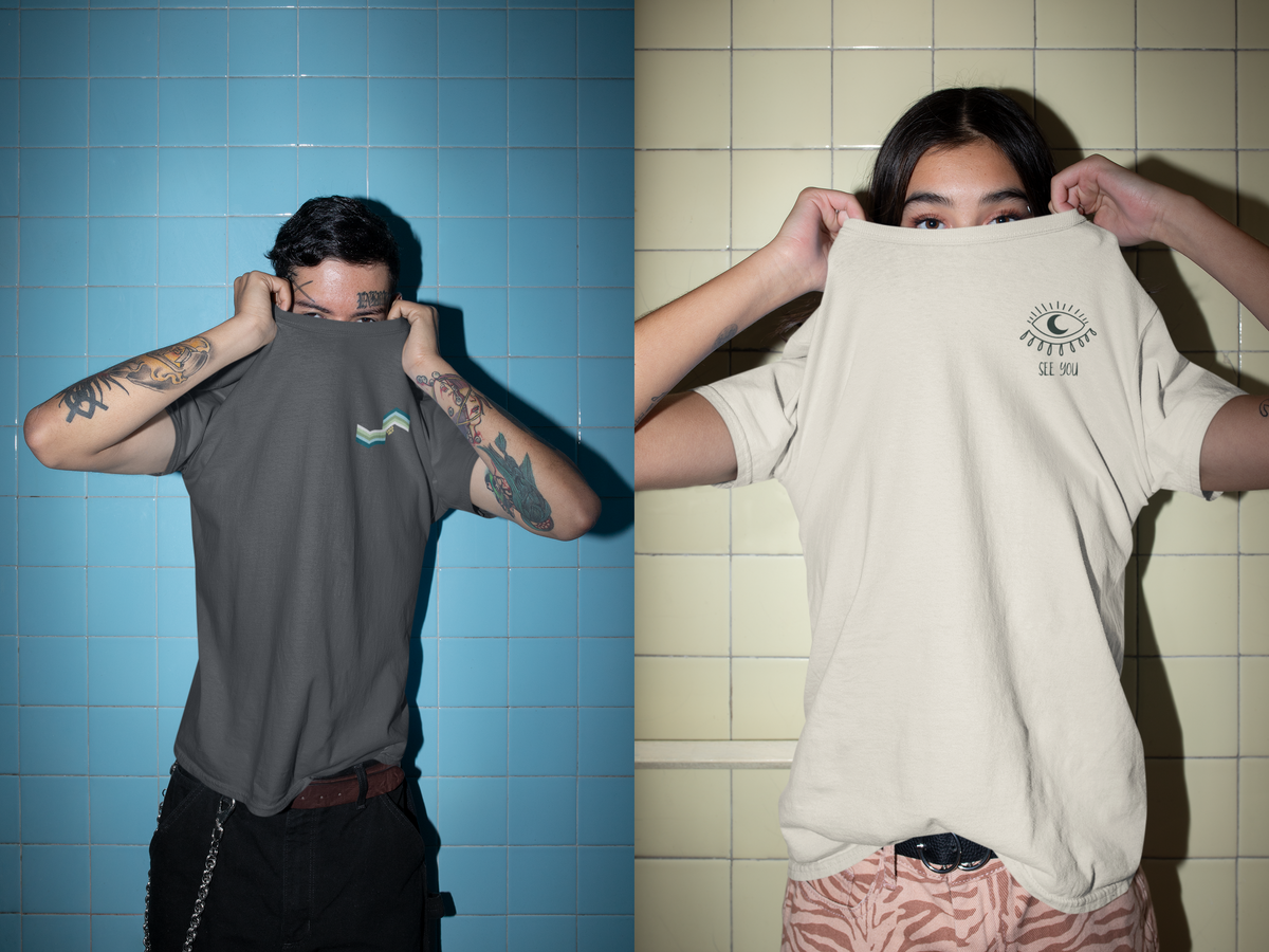 Two people hiding their faces with their tshirts 