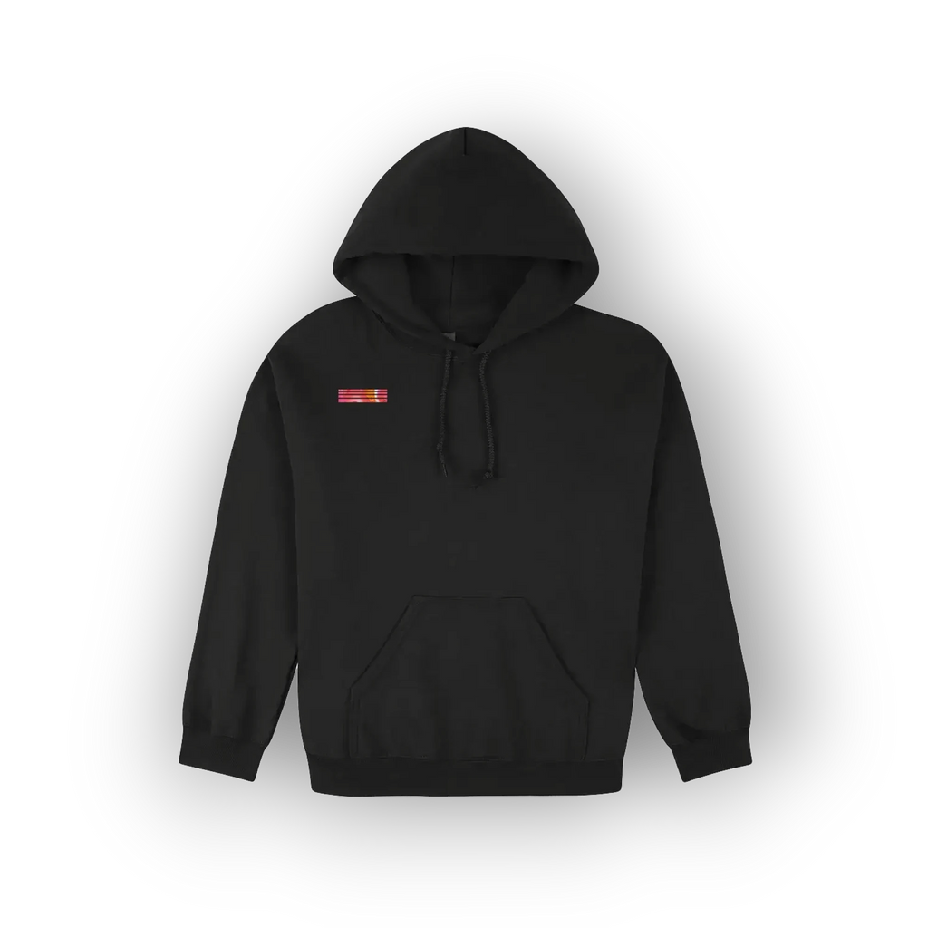A black pullover hoodie with a small red and yellow rectangular patch on the left chest, displayed against a clean white background with a soft drop shadow.