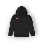 A black pullover hoodie with a small red and yellow rectangular patch on the left chest, displayed against a clean white background with a soft drop shadow.