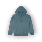 A slate blue pullover hoodie with a small red and yellow graphic on the left chest, displayed against a white background with a soft drop shadow.
