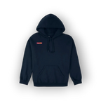 A navy blue pullover hoodie with a small red and yellow embroidered chest patch, displayed against a clean white background with a soft drop shadow.