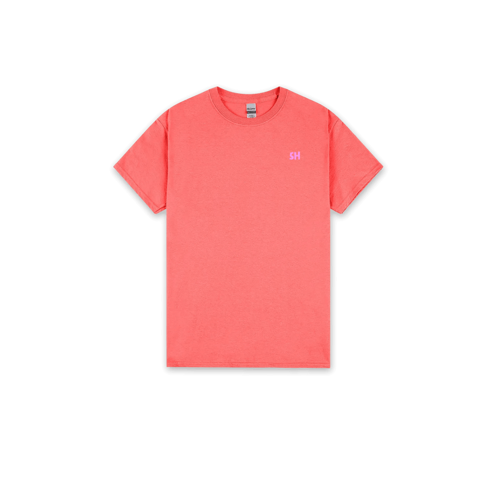 A coral pink crewneck t-shirt with a small pink 'SH' logo on the left chest, displayed flat against a solid white background.