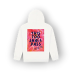 A white hooded sweatshirt shown from the back, featuring a large square graphic print with a pink and orange floral background and the text 'THIS TOO SHALL PASS' in dark blue lettering.